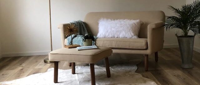 living room with beige sofa